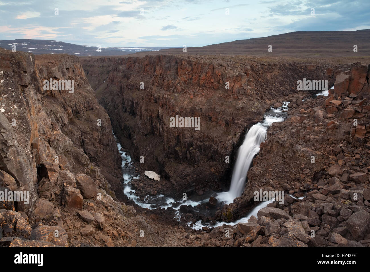 Putorana Plateau, a waterfall on the Grayling Stream. Mountain stream on a  cloudy day Stock Photo - Alamy