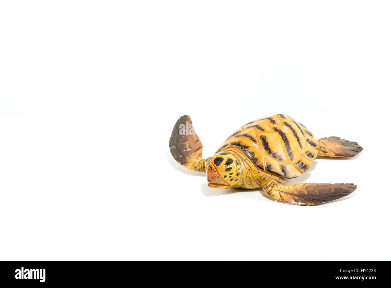 Turtle carved on wood isolated in white background Stock Photo