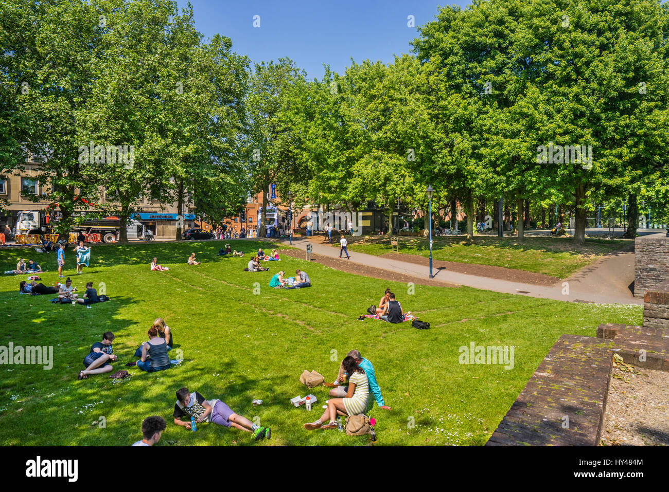 United Kingdom, South West England, Bristol, relaxing on the meadow of Castle Park Stock Photo