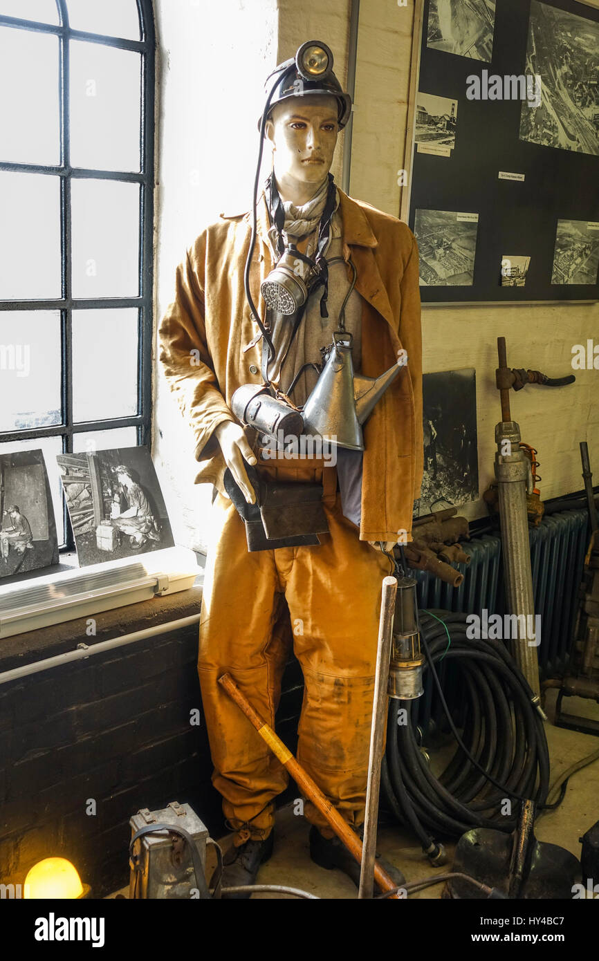 Miners' outfit with mask and helmet, safety suit on display at Coal mine,  mining Museum, Heerlen, Limburg, Netherlands Stock Photo - Alamy
