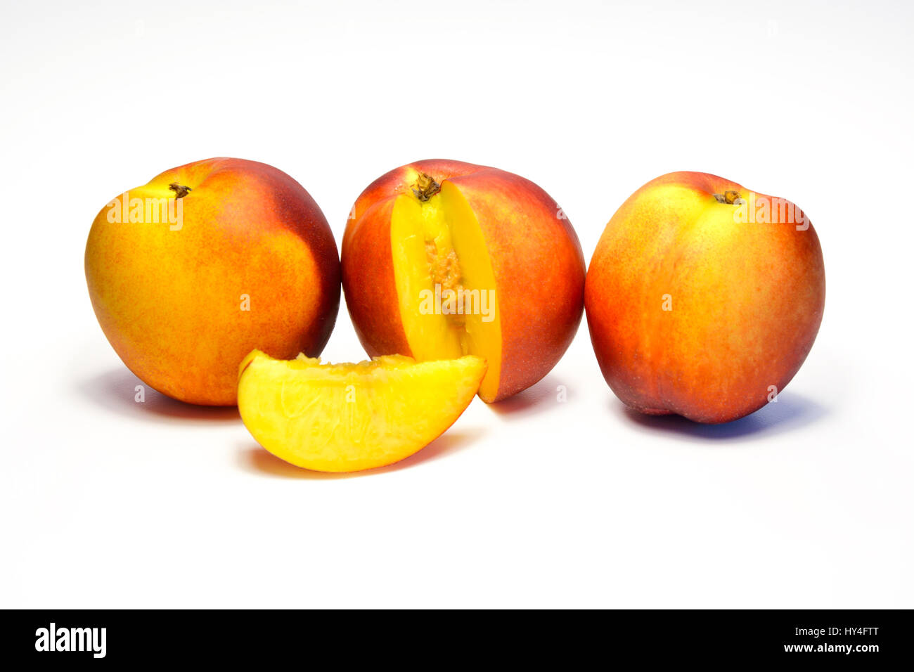 sweet freshness of nectarines, peach isolated on white background Stock