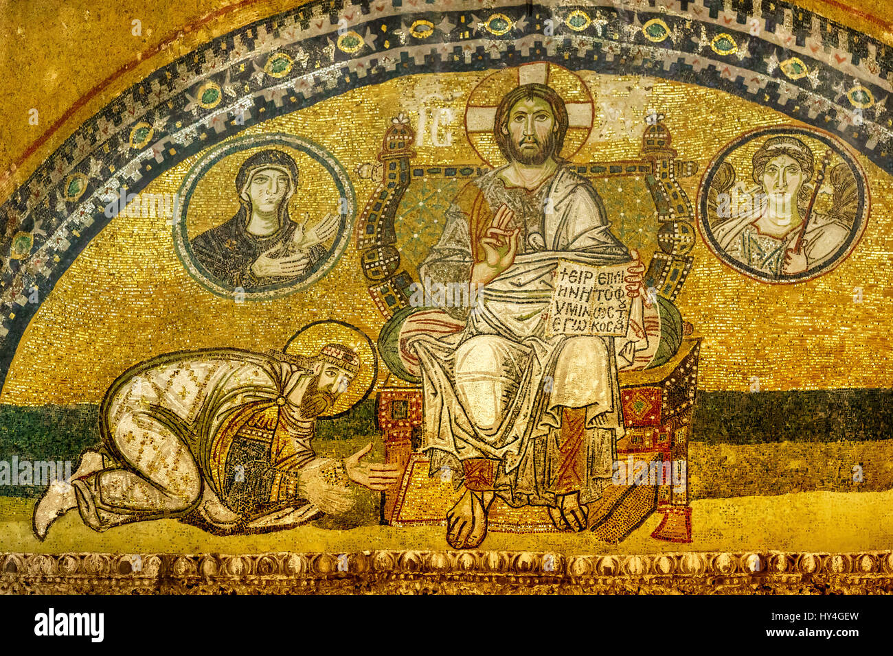 Hagia sofia. Mosaic in the imperial port. The Emperor kneels to Christ Pantokrator. In the book: Peace be with you, I am the light. Stock Photo
