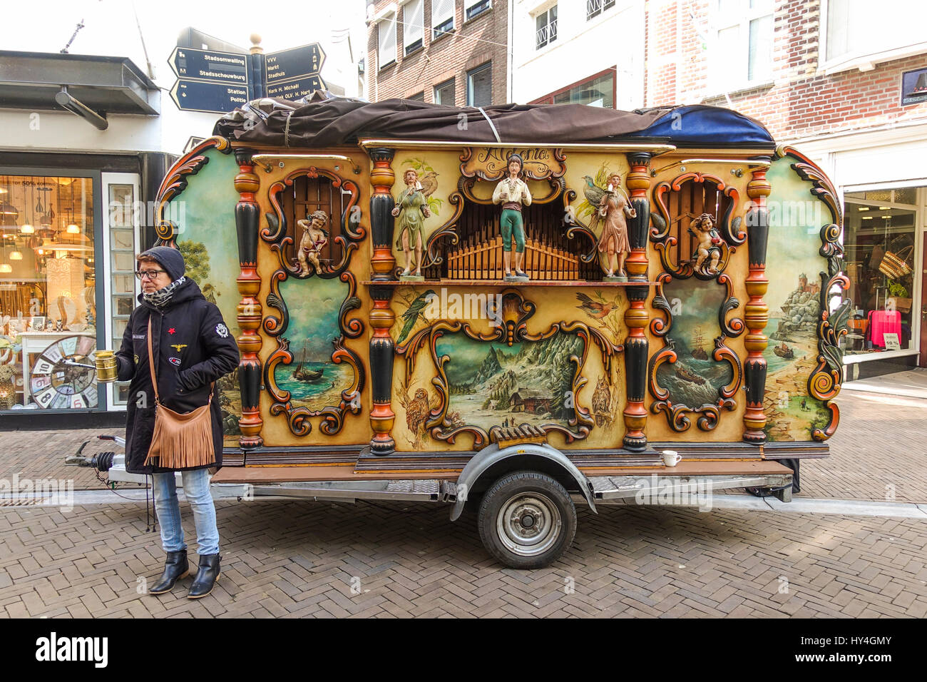 Woman next to barrel organ, street organ, in the streets of Sittard, Limburg, Netherlands Stock Photo