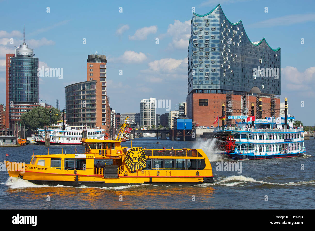 ElbfÃ¤hre (ferry) and harbour cruise in front of the backdrop of HafenCity of Hamburg and the Elbe Philharmonic Hall, Stock Photo