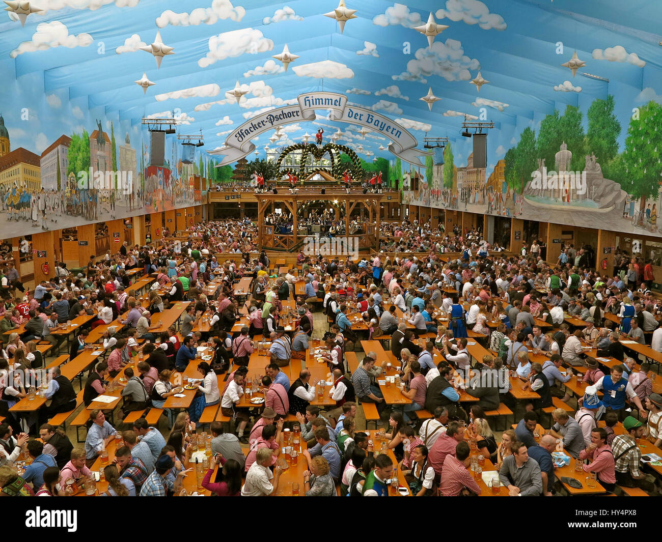 Oktoberfest 2016, Hacker-Pschorr Marquee, new painting, sky of Bavaria, Interior, bird's-eye view, Oktoberfest visitors, eat, drink, party, beer mugs, music, chapel, podium with SchÃ¤fflertÃ¤nzern (dancers), Stock Photo