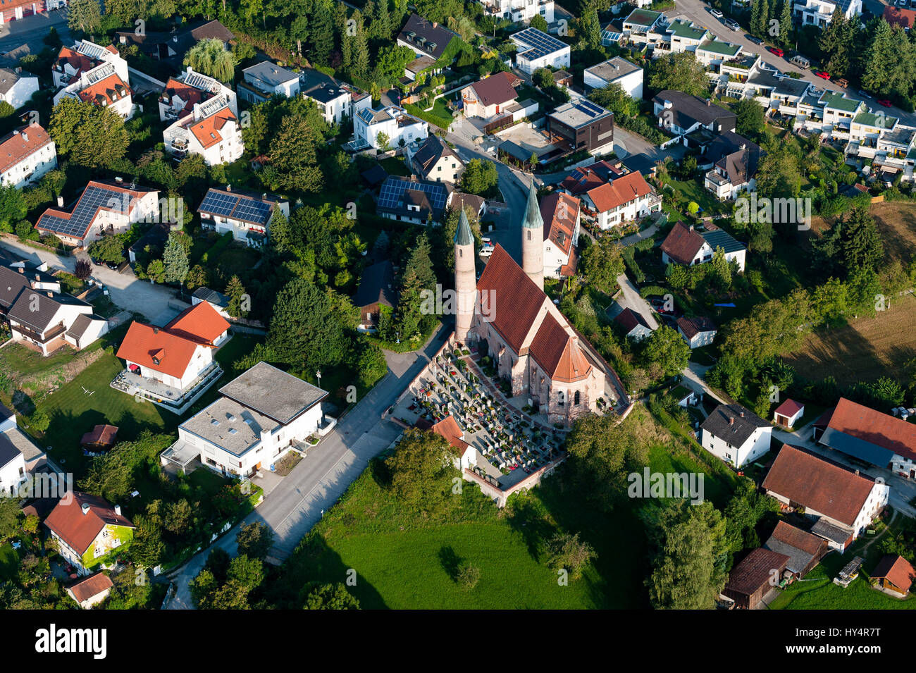 The Pfarrkirche Heilig Blut (church) in Berg a part of town of Landshut with cemetery and neighbouring houses, bird's-eye view Stock Photo