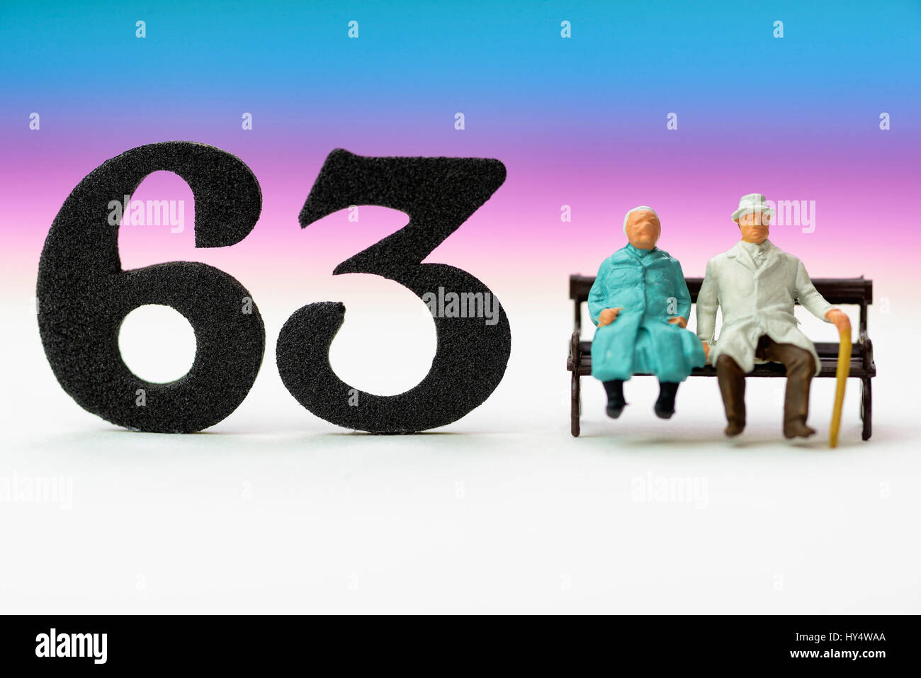 Senior citizen's pair and the number 63, symbolic photo pension at the age of 63 years, Seniorenpaar und die Zahl 63, Symbolfoto Rente mit 63 Jahren Stock Photo