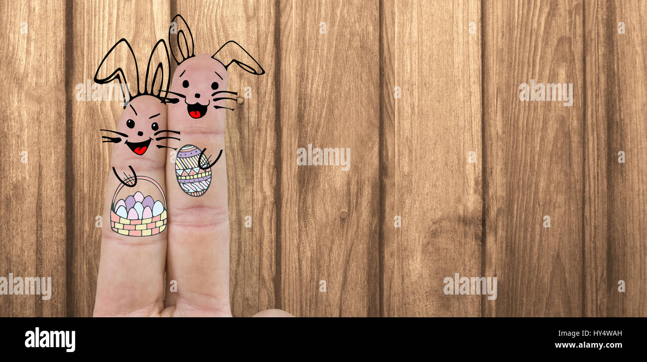Illustration of fingers representing Easter bunny  against wood Stock Photo