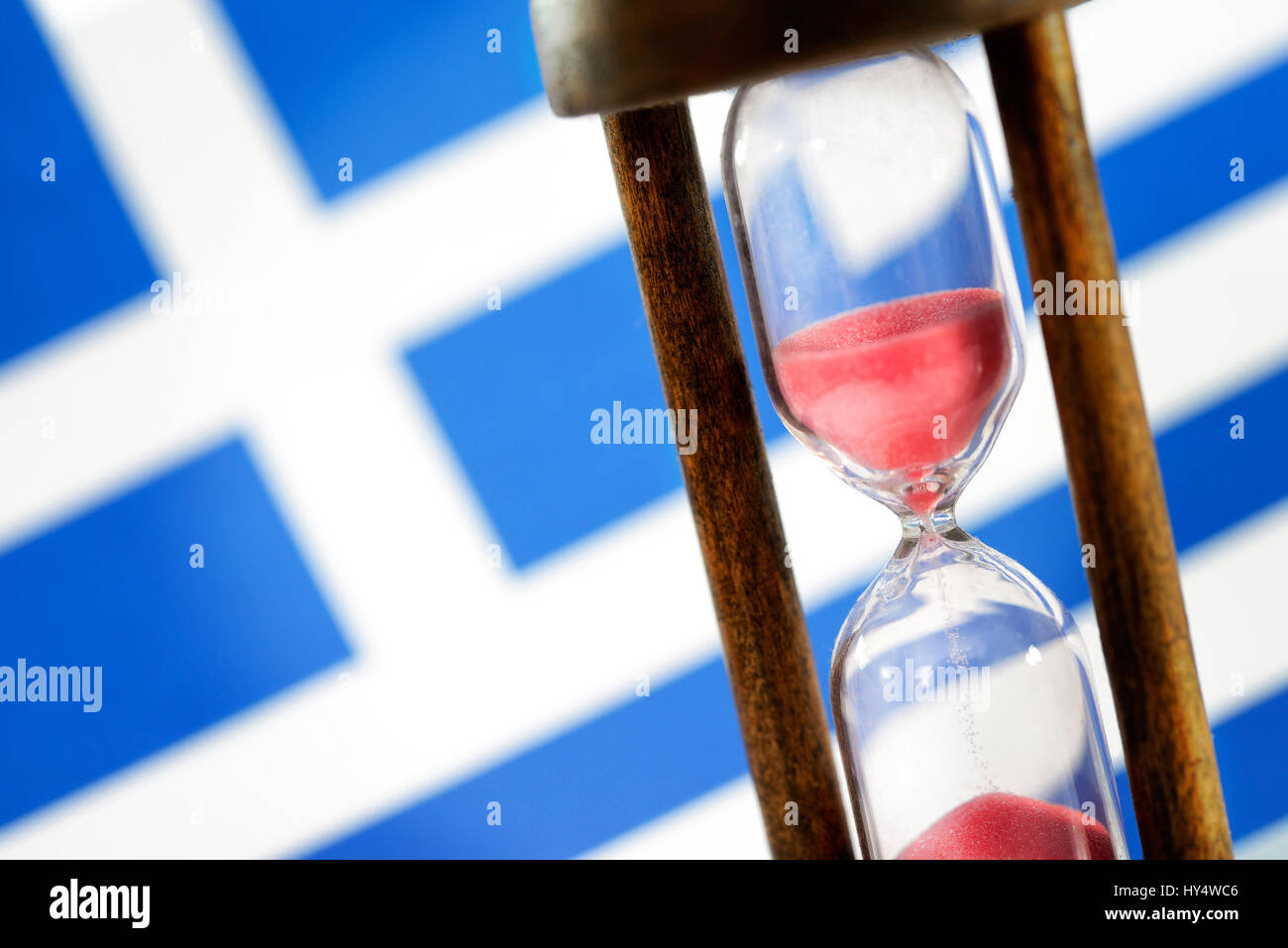 Greek flag and hourglass, symbolic photo Greek debt crisis, Griechische Fahne und Sanduhr, Symbolfoto griechische Schuldenkrise Stock Photo