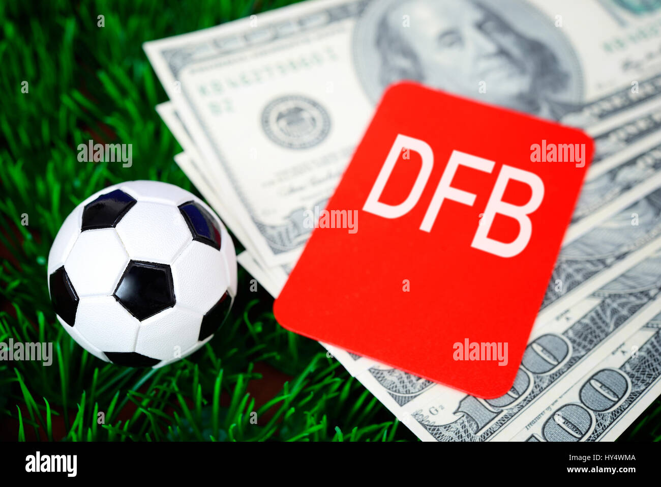 Miniature football, red map and dollar notes, German Football Association scandal, Miniaturfu?ball, rote Karte und Dollarscheine, DFB-Skandal Stock Photo