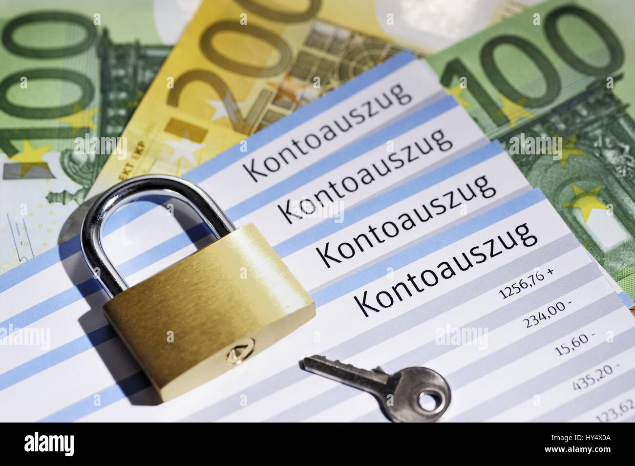 Bank statements and padlock, security of bank data, Kontoauszuege und Vorhaengeschloss, Sicherheit von Bankdaten Stock Photo