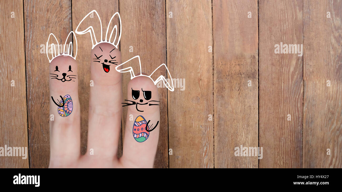 Vector image of fingers representing Easter bunny  against wood panelling Stock Photo