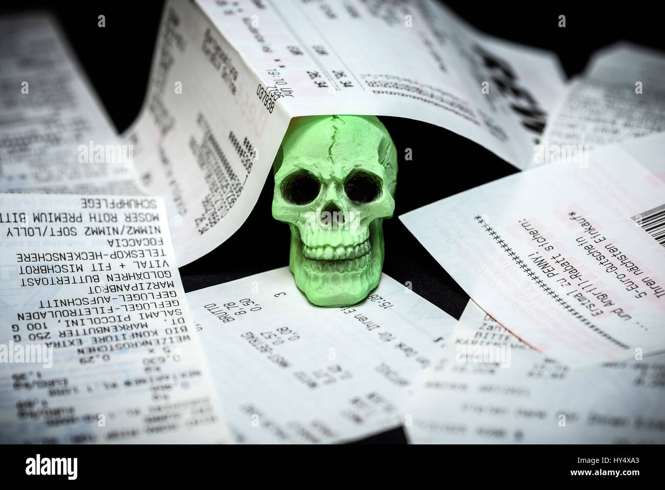 Receipts and death's-head, injurious Bisphenol A in thermo paper, Kassenbons und Totenkopf, schaedliches Bisphenol A in Thermopapier Stock Photo