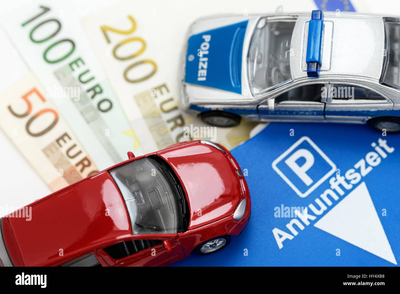 https://c8.alamy.com/comp/HY4XB8/miniature-car-bank-notes-and-parking-disc-higher-punishments-for-falschparker-HY4XB8.jpg