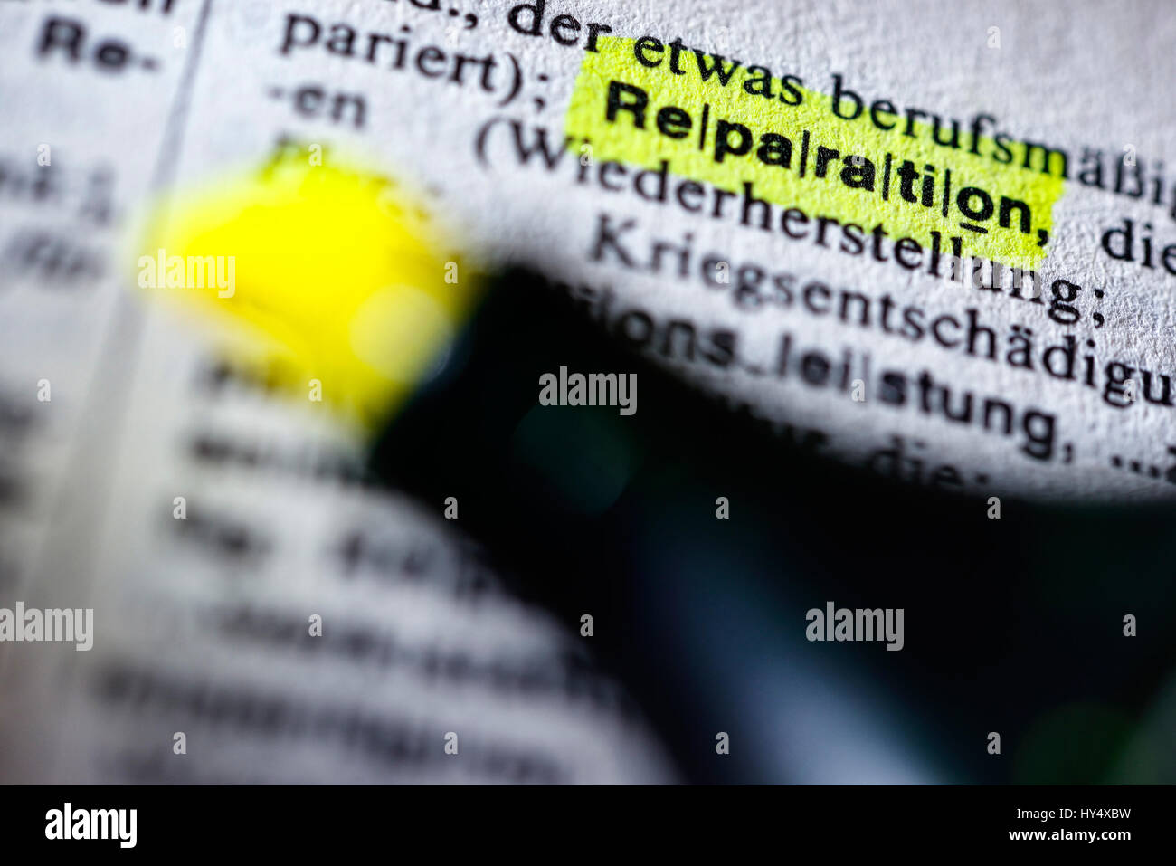 The word Reparation in a dictionary, Das Wort Reparation in einem Woerterbuch Stock Photo
