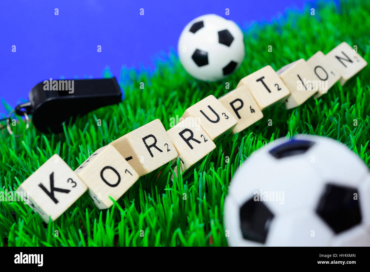 Stroke corruption from cube letter and miniature soccer balls, Fifa scandal, Schriftzug Korruption aus Wuerfelbuchstaben und Miniaturfu?baelle, Fifa-S Stock Photo