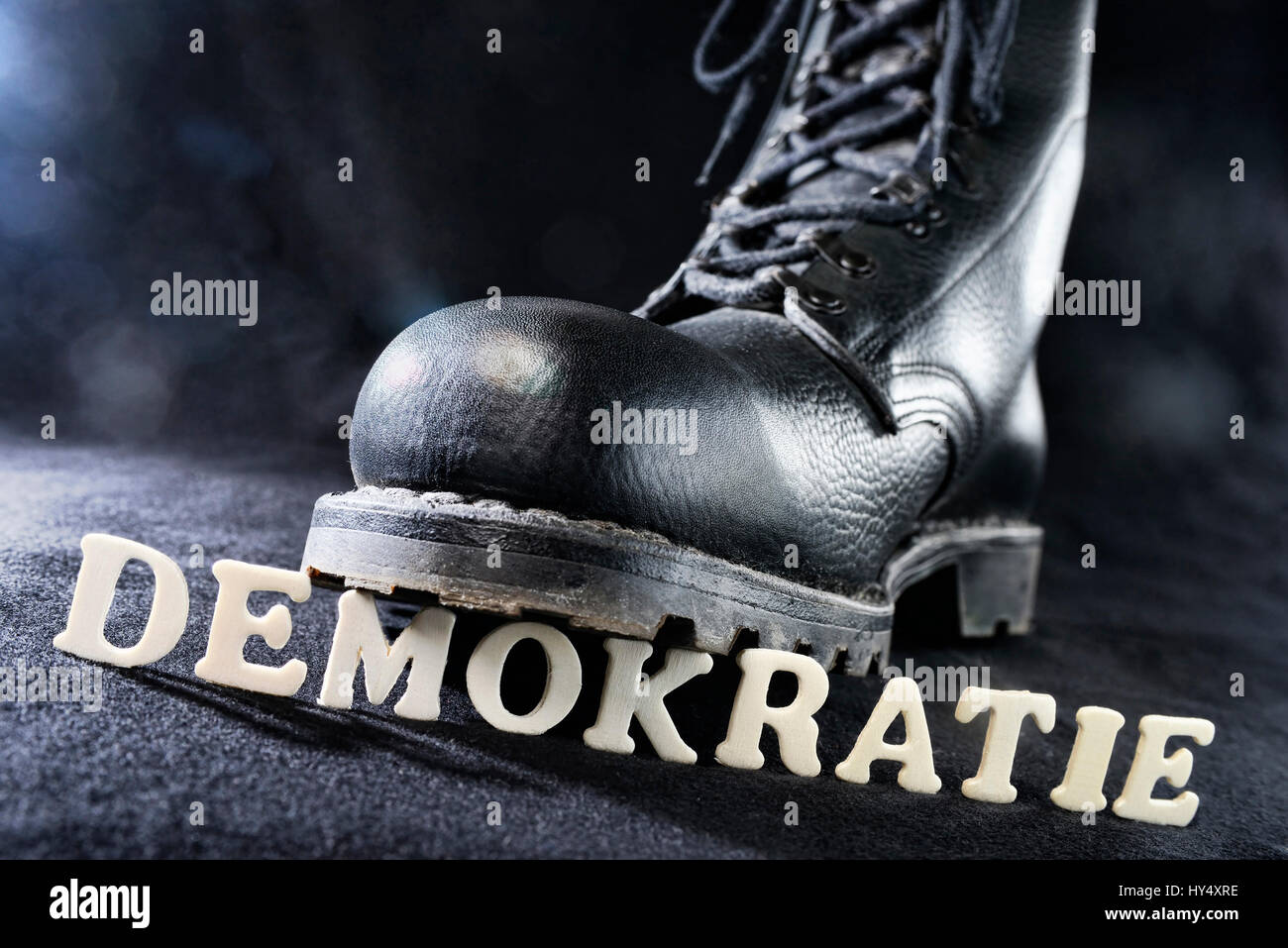 Jumper's boot on democracy stroke, right-wing extremism, Springerstiefel auf Demokratie-Schriftzug, Rechtsextremismus Stock Photo