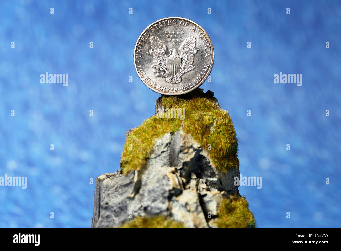 US-silver dollar on cliff, tax inspector's cliff, US-Silberdollar auf Klippe, Fiskalklippe Stock Photo
