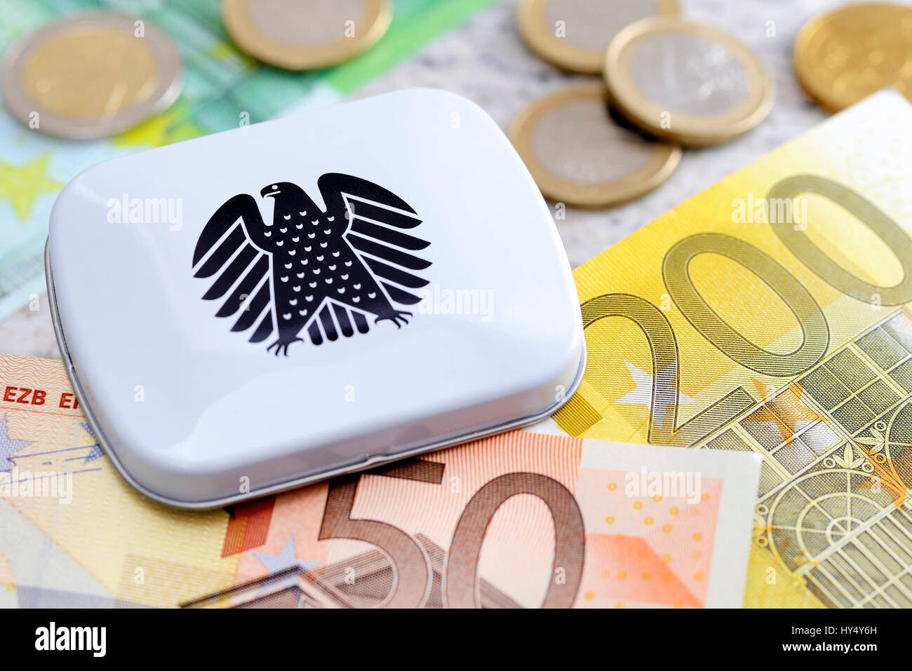 Tin with federal eagle and bank notes, parliamentary pay rise, Dose mit Bundesadler und Geldscheine, Diaetenerhoehung Stock Photo