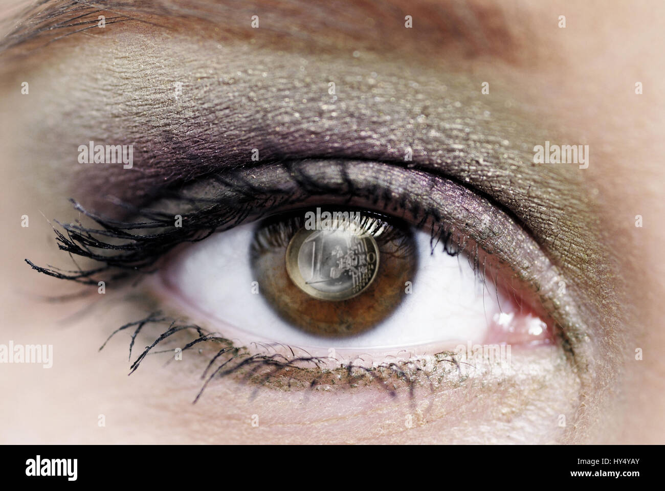 Eye of a woman with 1-euro-coin, Auge einer Frau mit 1-Euro-Muenze Stock Photo