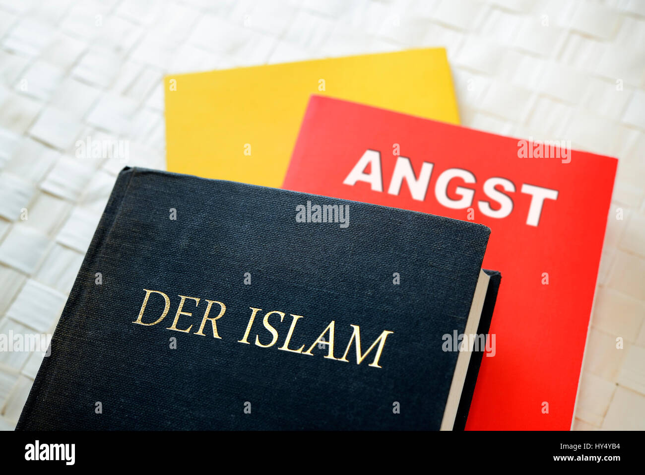 Books in German national colours, Islam and fear, Buecher in deutschen Nationalfarben, der Islam und Angst Stock Photo