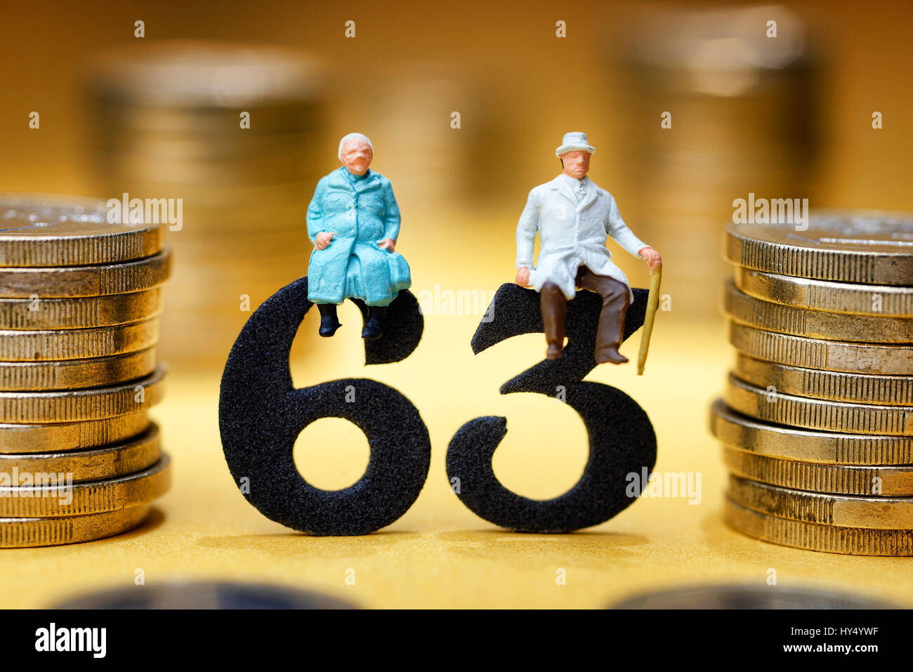Senior citizen's pair on the number 63, symbolic photo pension at the age of 63 years, Seniorenpaar auf der Zahl 63, Symbolfoto Rente mit 63 Jahren Stock Photo
