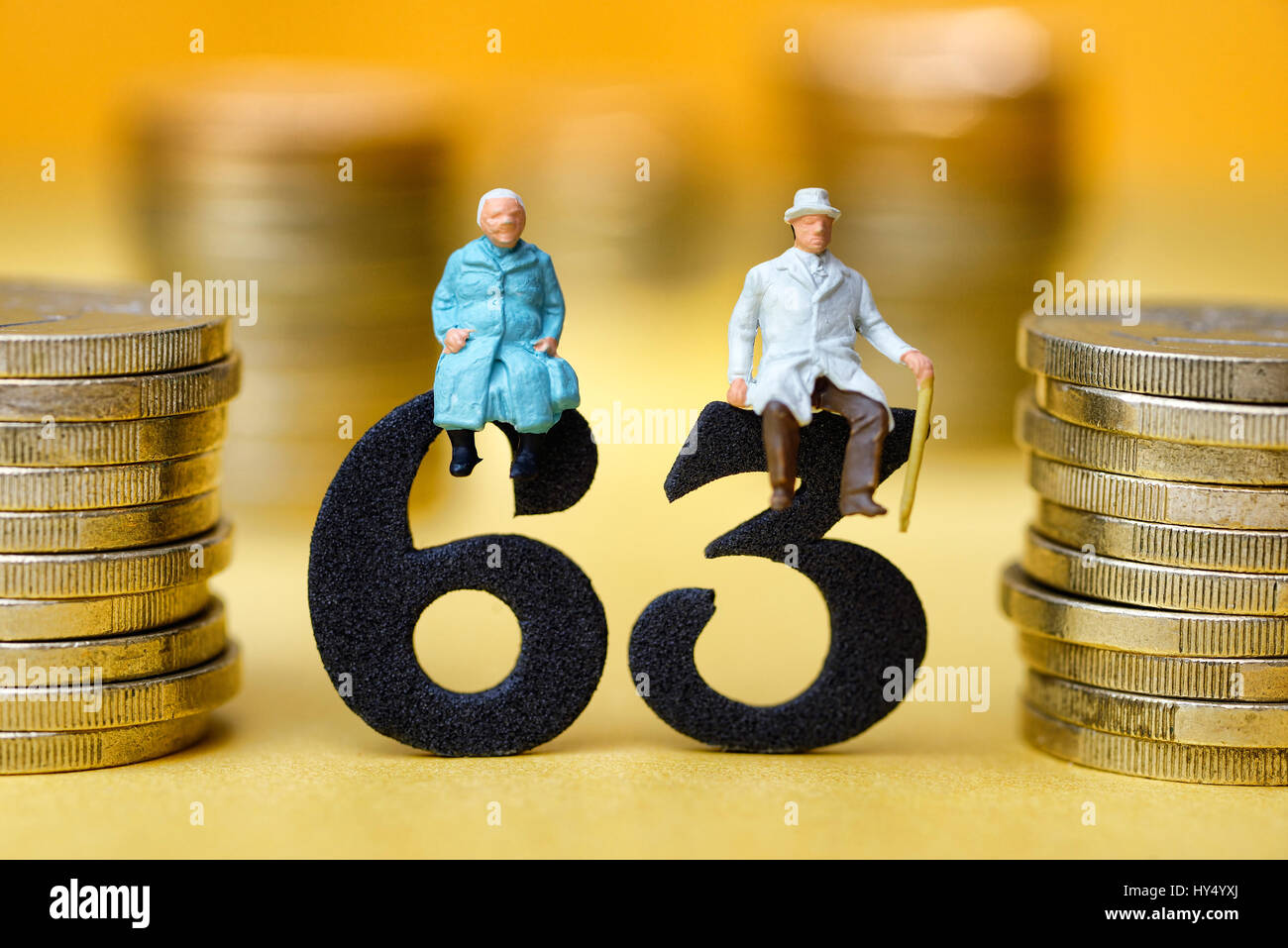 Senior citizen's pair on the number 63, symbolic photo pension at the age of 63 years, Seniorenpaar auf der Zahl 63, Symbolfoto Rente mit 63 Jahren Stock Photo