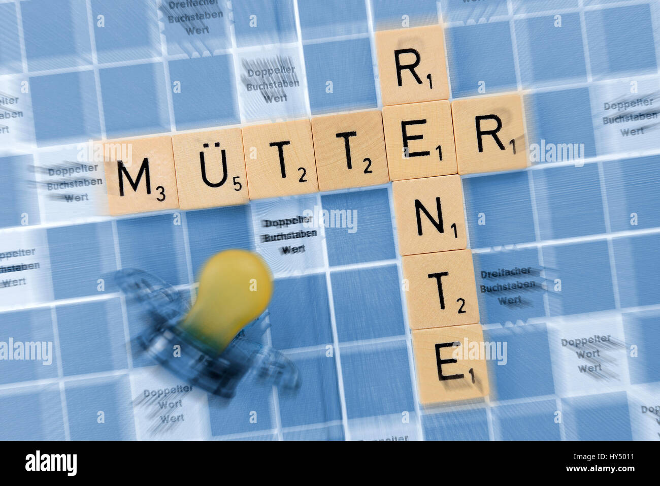 Play stones with stroke mother's pension, Spielsteine mit Schriftzug Muetterrente Stock Photo