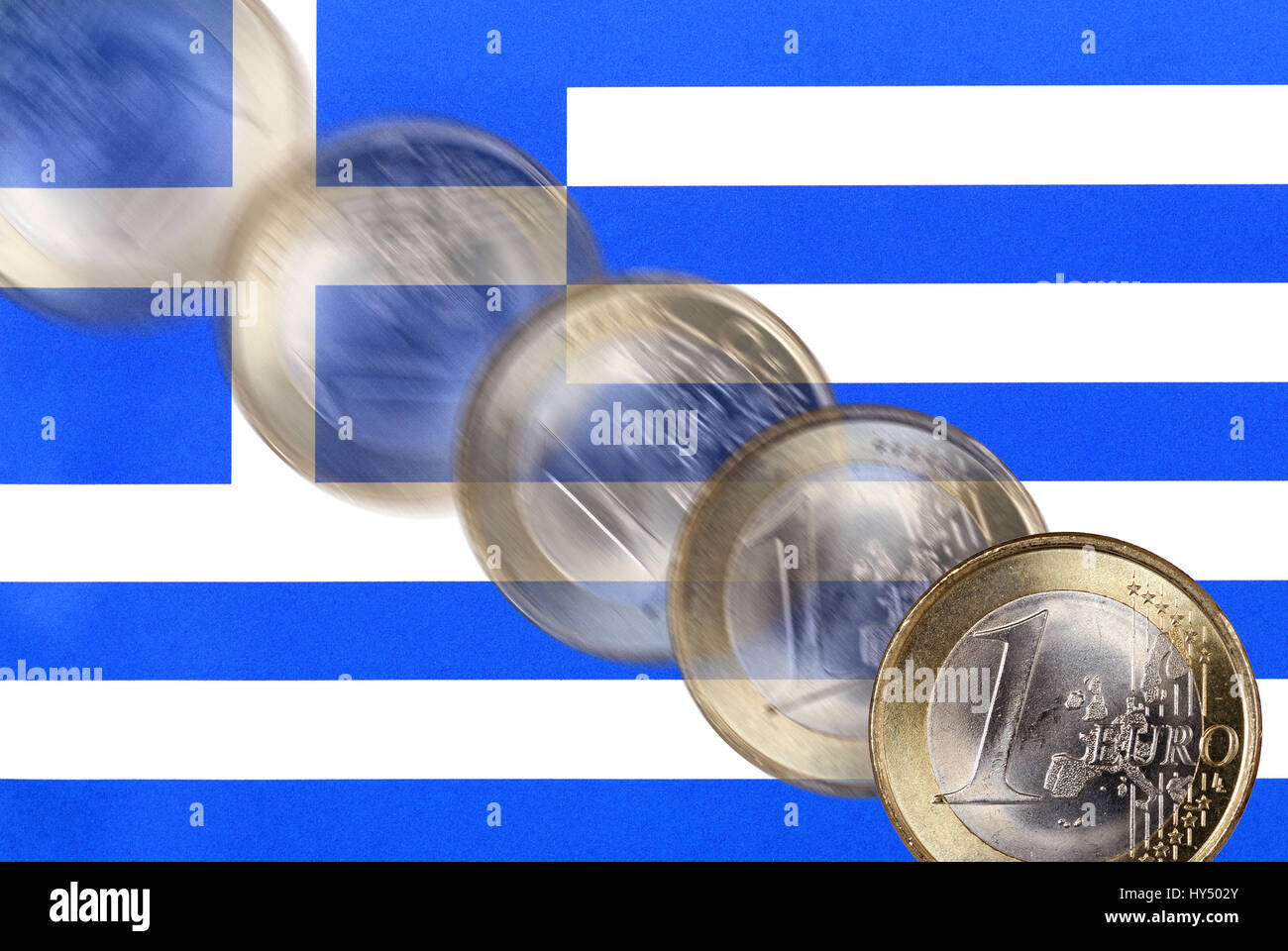 Greek national flag and falling euro-coin, Greek state indebtedness and falling euro-course, Griechische Nationalflagge und stuerzende Euro-Muenze, gr Stock Photo