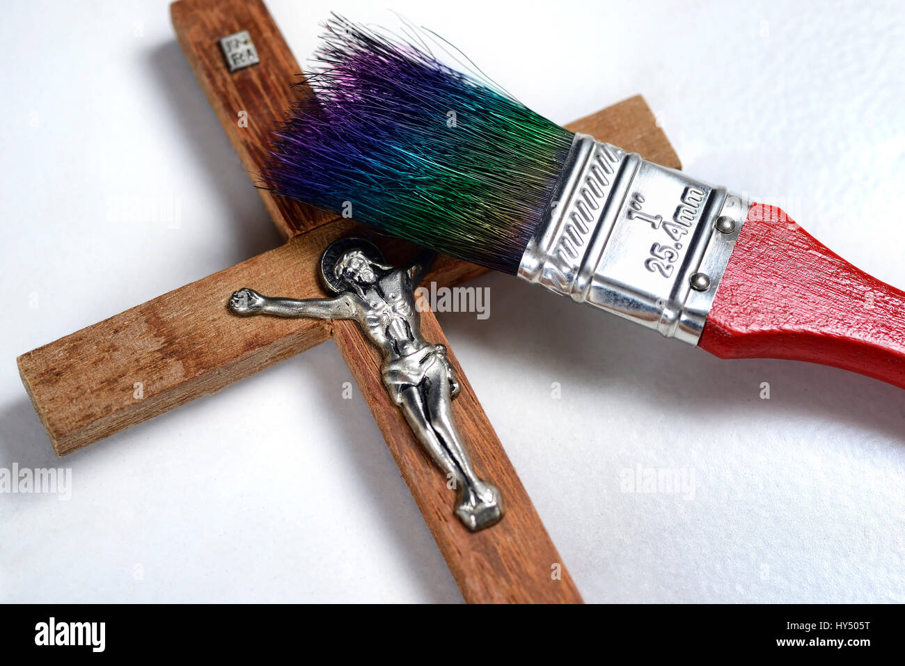 Cross with paintbrush, new painting for the church, Kreuz mit Pinsel, neuer Anstrich fuer die Kirche Stock Photo