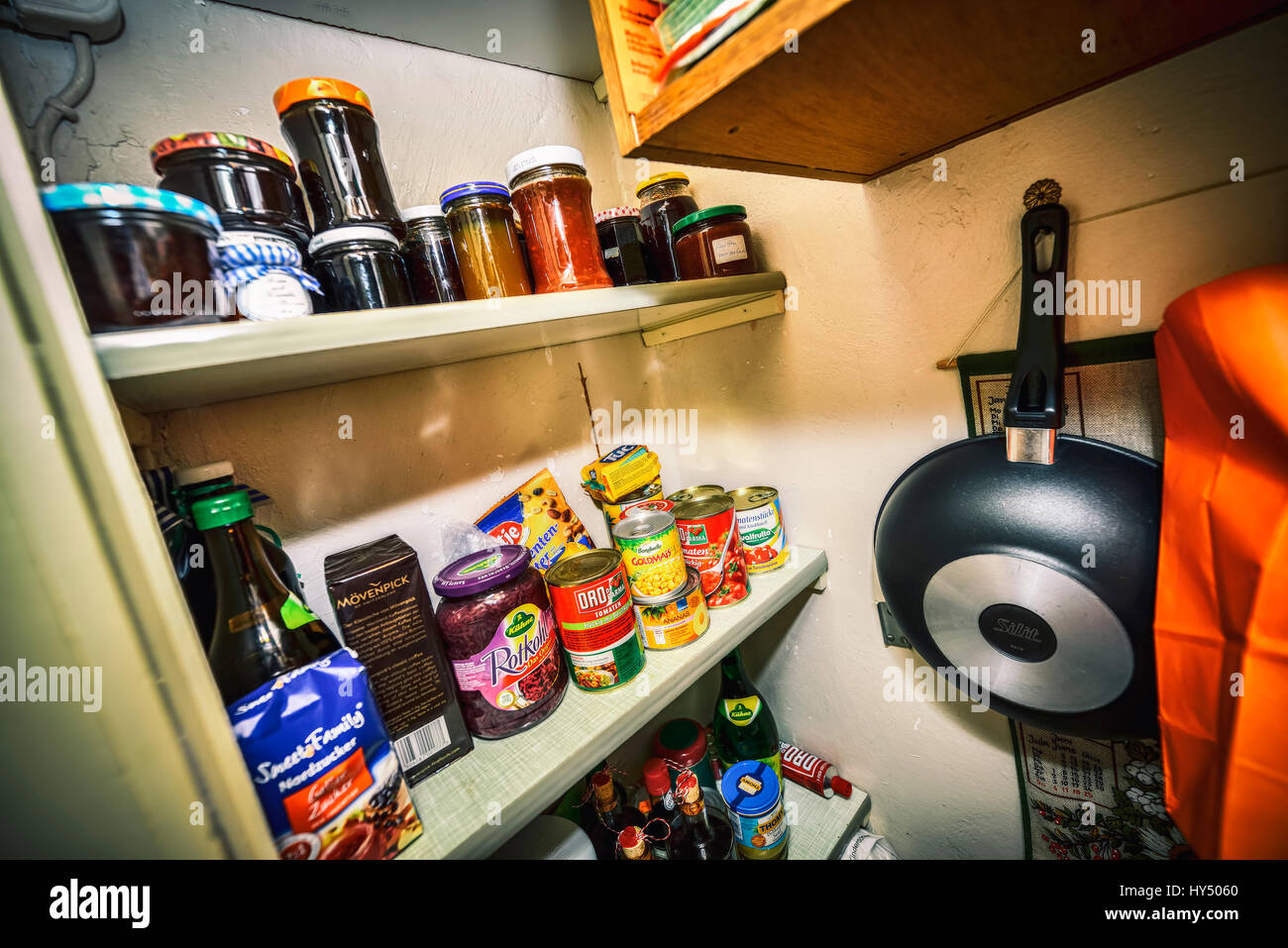 Pantry with canned food tins and bottling jars, Speisekammer mit Konservendosen und Einmachglaesern Stock Photo