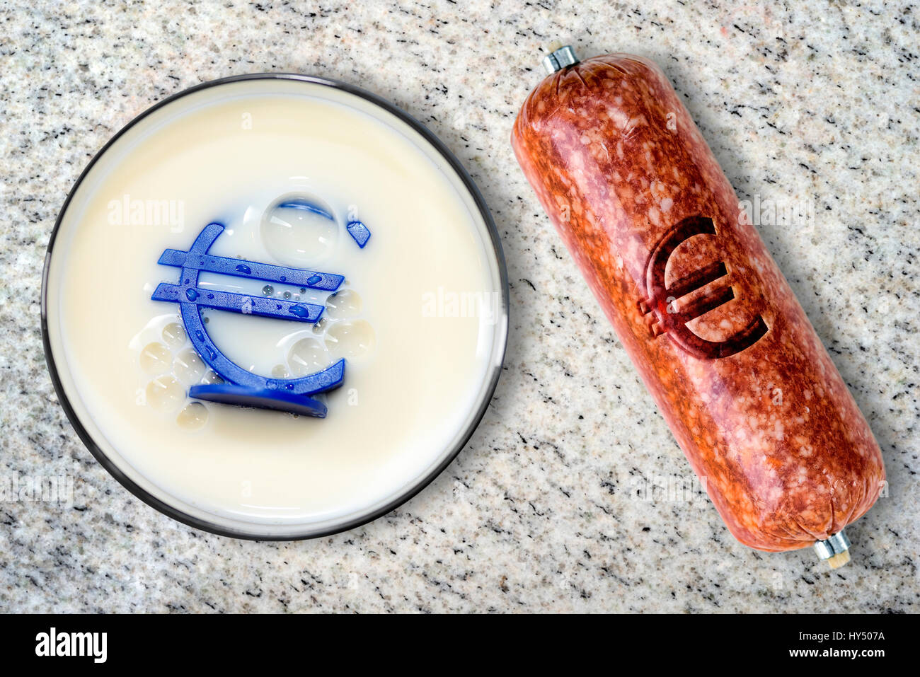 Milk and sausage with eurosign, proposal of a raised tax rate for milk products and meat products, Milch und Wurst mit Eurozeichen, Vorschlag eines er Stock Photo