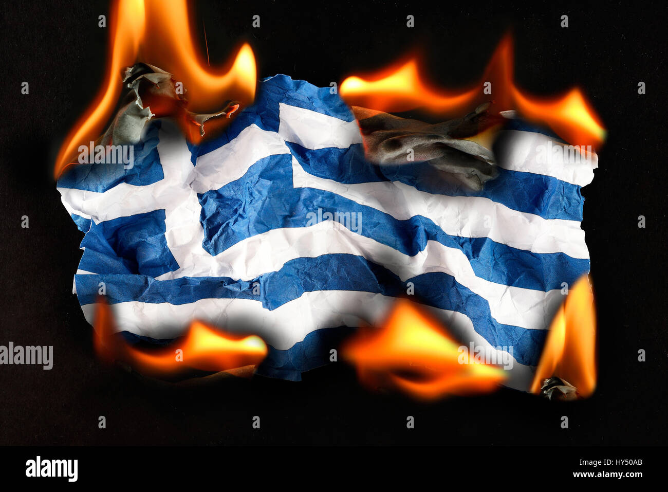Greece flag in flames, symbolic photo debt quarrel, Griechenlandfahne in Flammen, Symbolfoto Schuldenstreit Stock Photo
