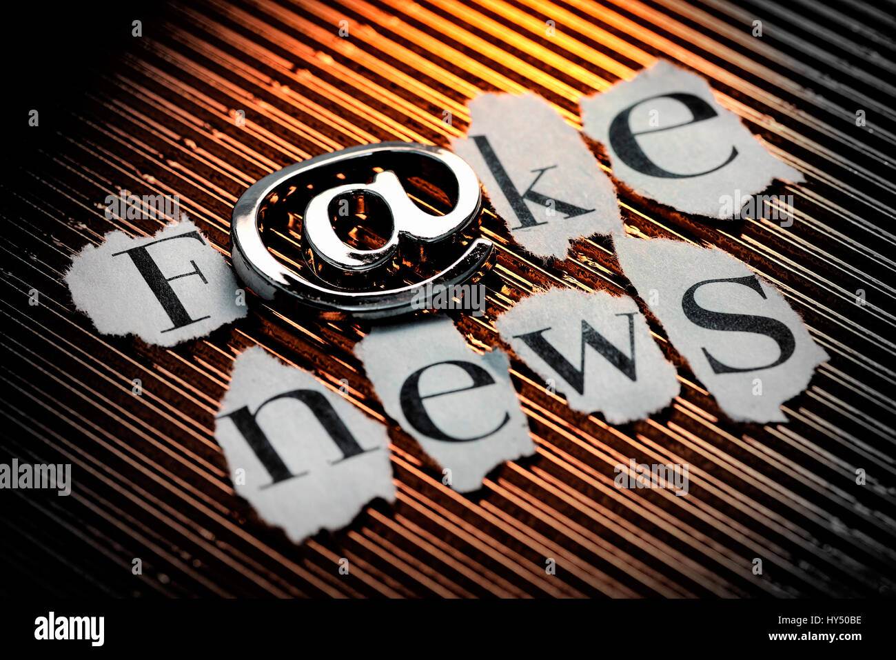 Stroke Fake news with at-sign, false alarms on the Internet, Schriftzug Fake News mit At-Zeichen, Falschmeldungen im Internet Stock Photo