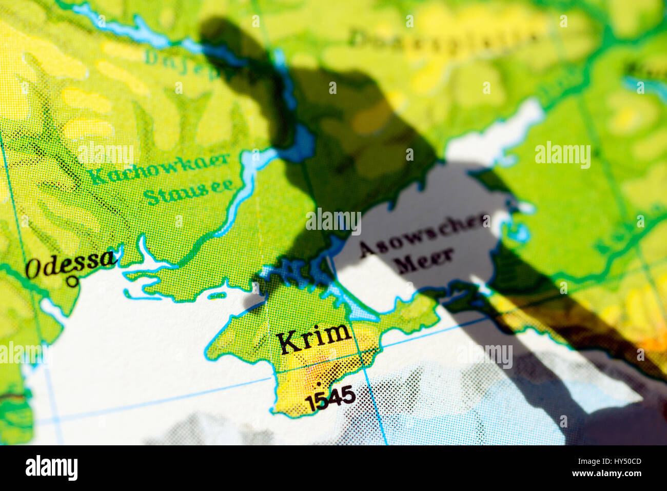 The Crimea on a map and shade of a soldier, Crimea crisis, Die Krim auf einer Landkarte und Schatten eines Soldaten, Krim-Krise Stock Photo