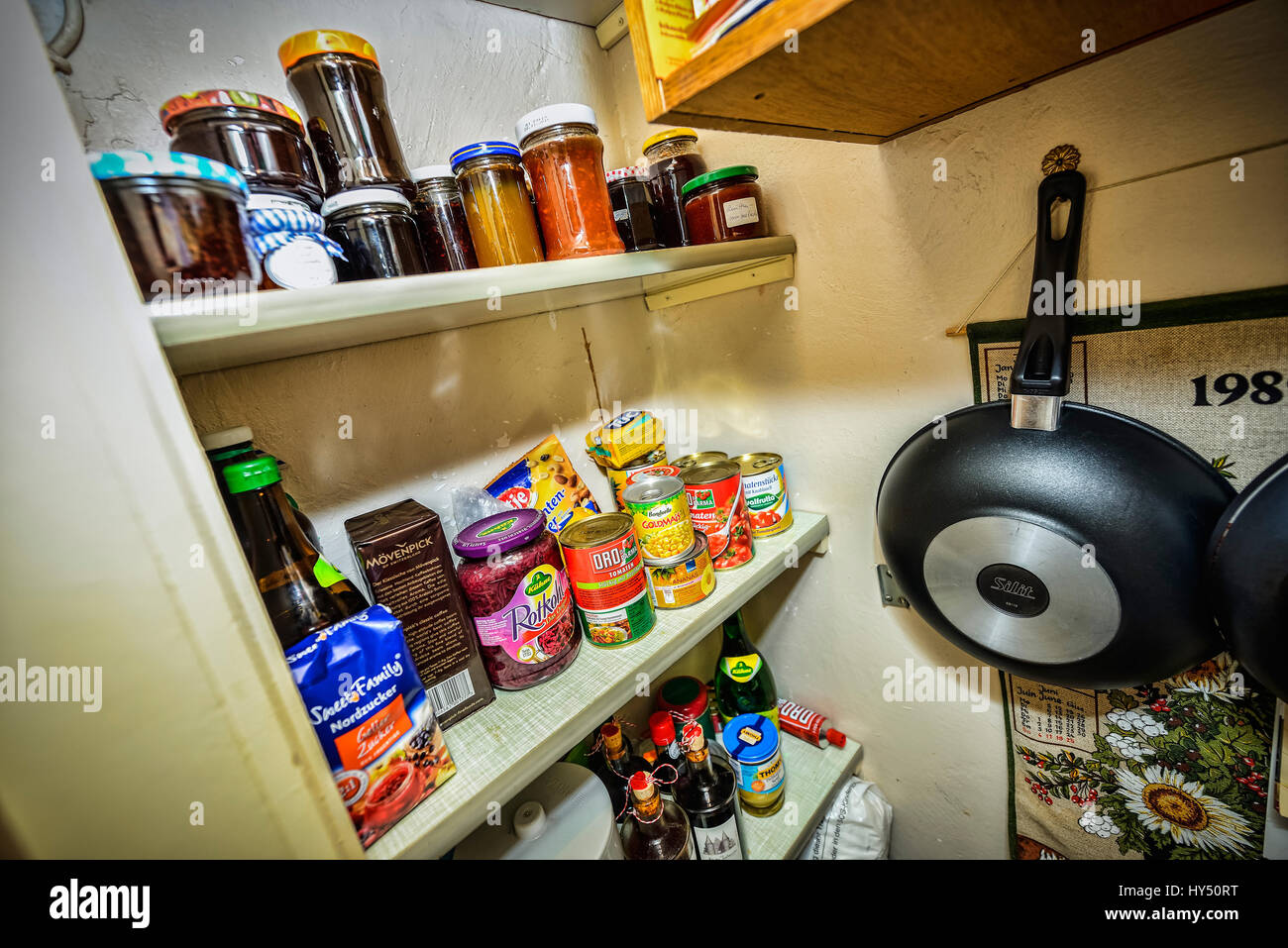 Pantry with canned food tins and bottling jars, Speisekammer mit Konservendosen und Einmachglaesern Stock Photo