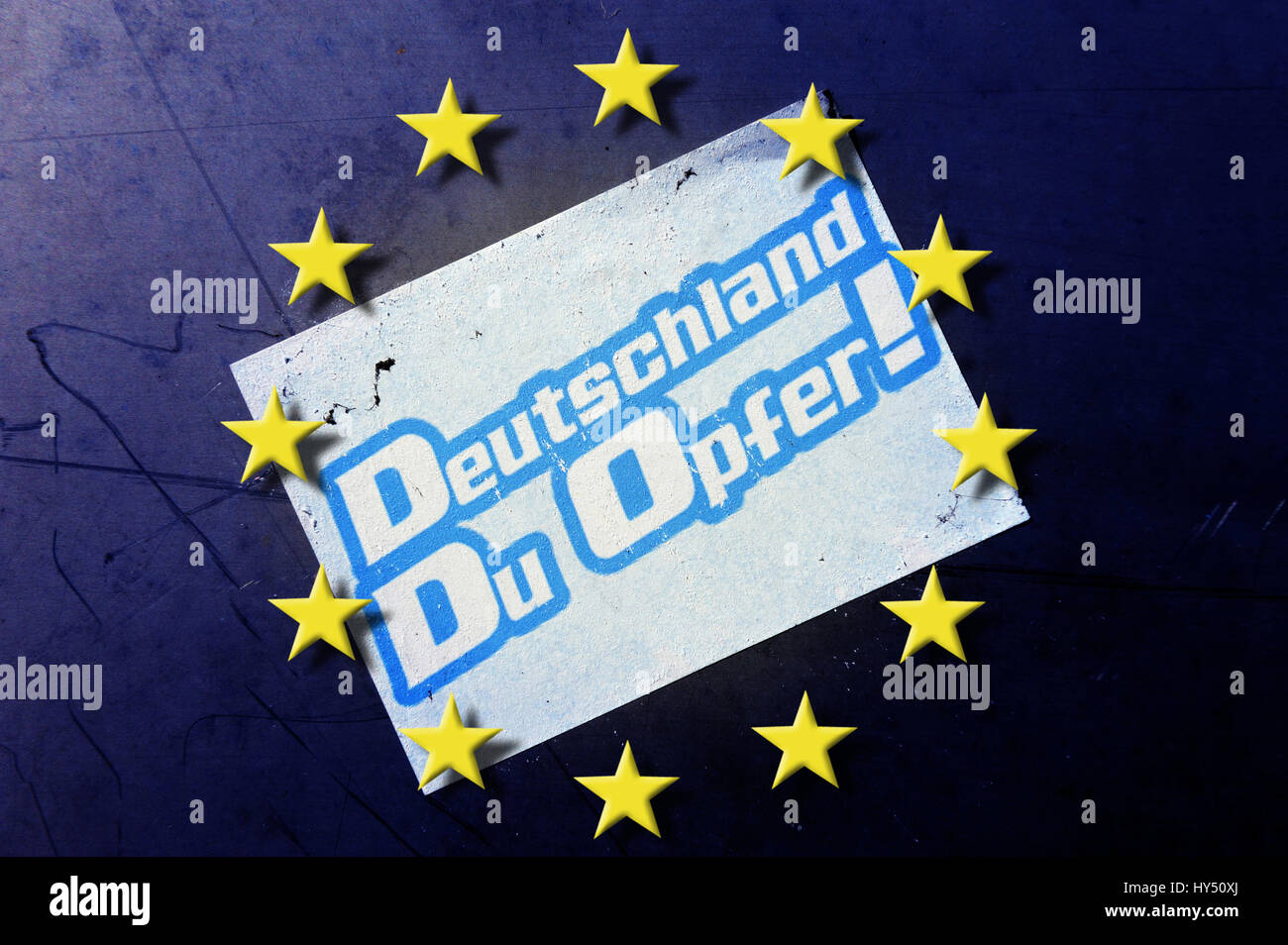 EU stars and stickers on a wall: Germany, you victim!, EU-Sterne und Aufkleber an einer Wand: Deutschland, Du Opfer! Stock Photo