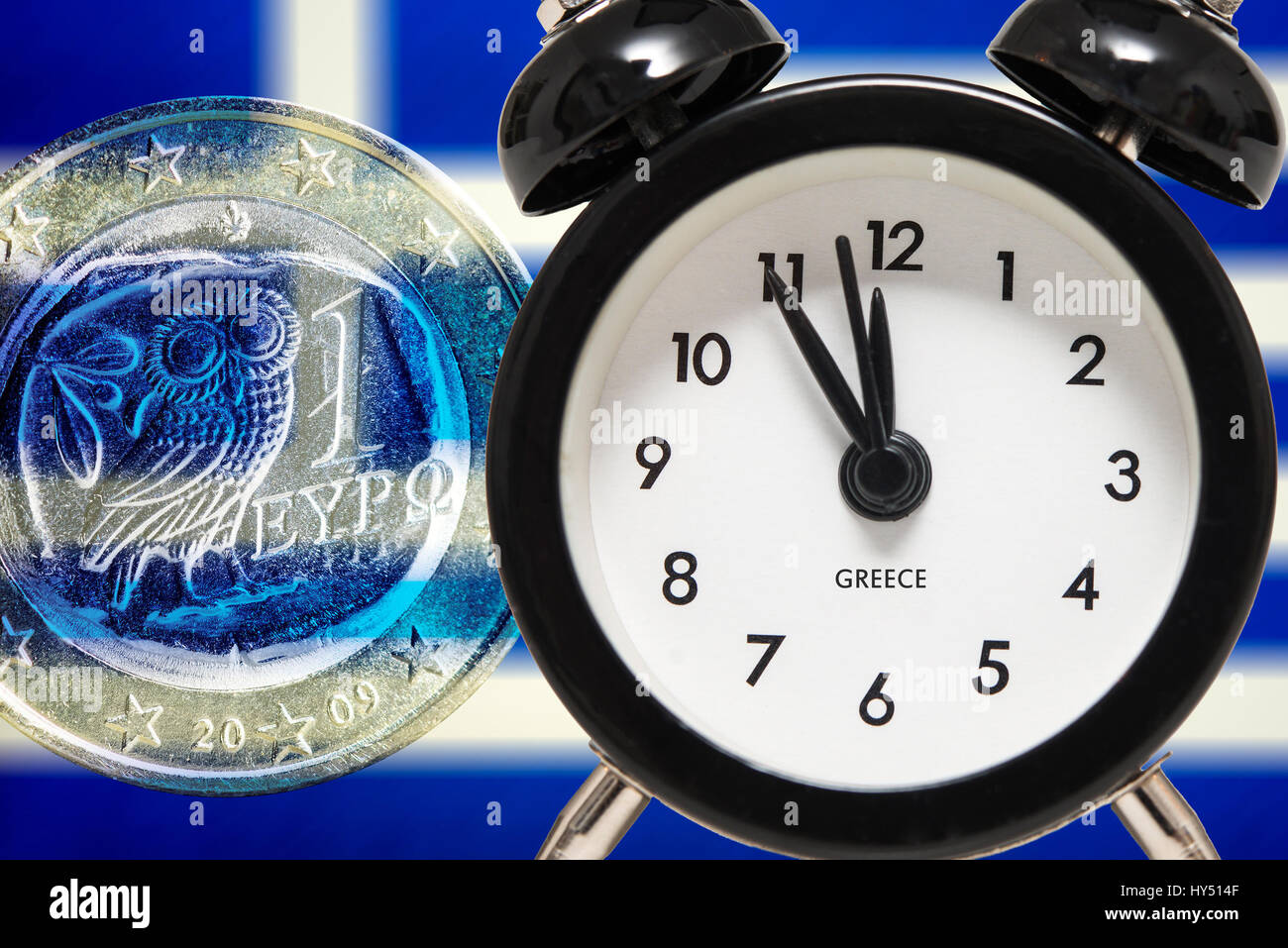 Alarm clock on five before twelve before Greek flag and euro, symbolic photo debt quarrel, Wecker auf Fuenf vor Zwoelf vor griechischer Fahne und Euro Stock Photo
