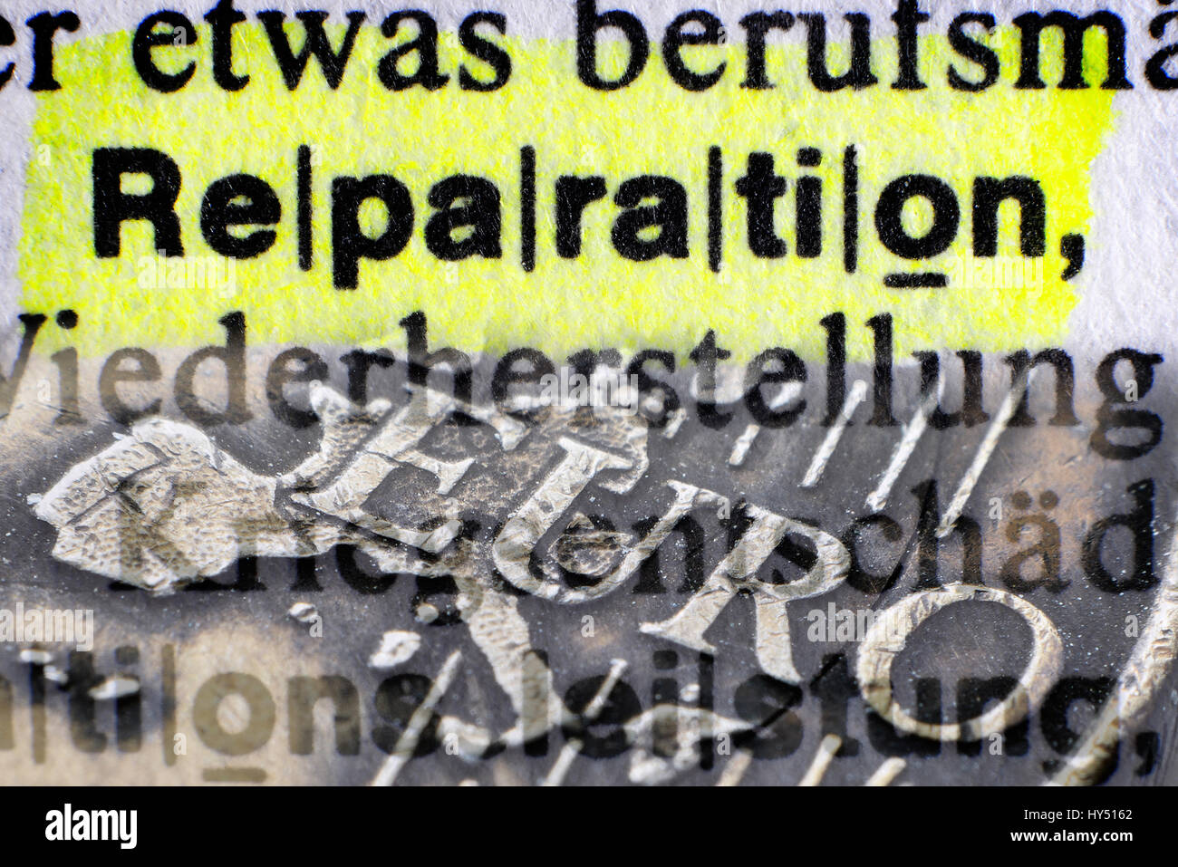 The word Reparation in a dictionary and eurocoin, Greek Reparationsforderungen, Das Wort Reparation in einem Woerterbuch und Euromuenze, griechische R Stock Photo