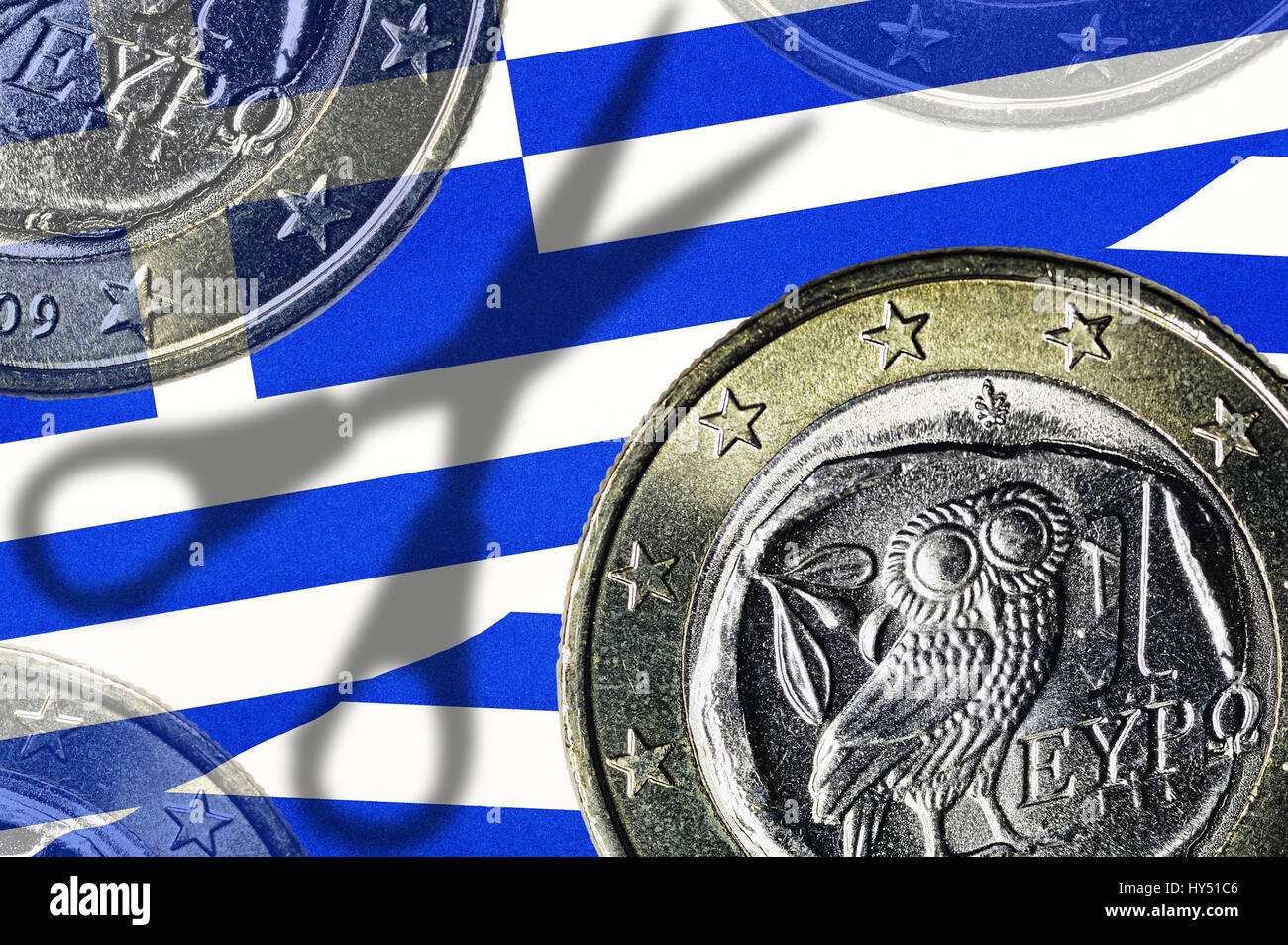 Greek eurocoins and shades of scissors, debt cut for Greece, Griechische Euromuenzen und Schatten einer Schere, Schuldenschnitt fuer Griechenland Stock Photo