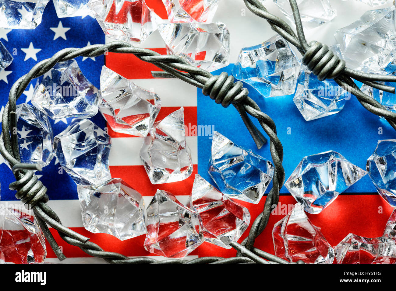 Flags of the USA and Russia with barbed wire and ice cubes, cold war, Fahnen von USA und Russland mit Stacheldraht und Eiswuerfeln, Kalter Krieg Stock Photo