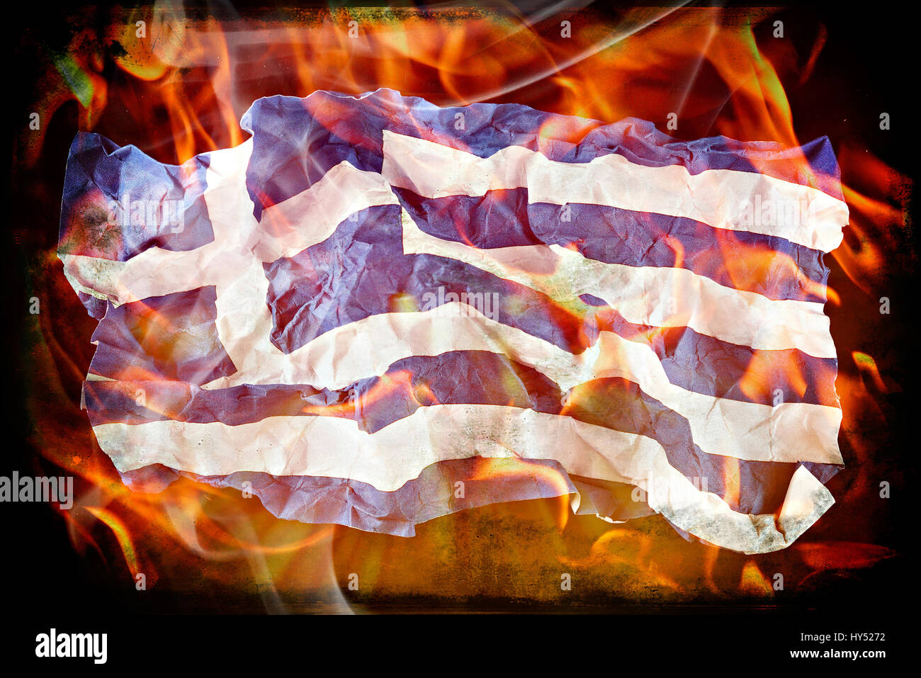 Crumpled Greek flag in flames, symbolic photo debt quarrel, Zerknitterte Griechische Fahne in Flammen, Symbolfoto Schuldenstreit Stock Photo