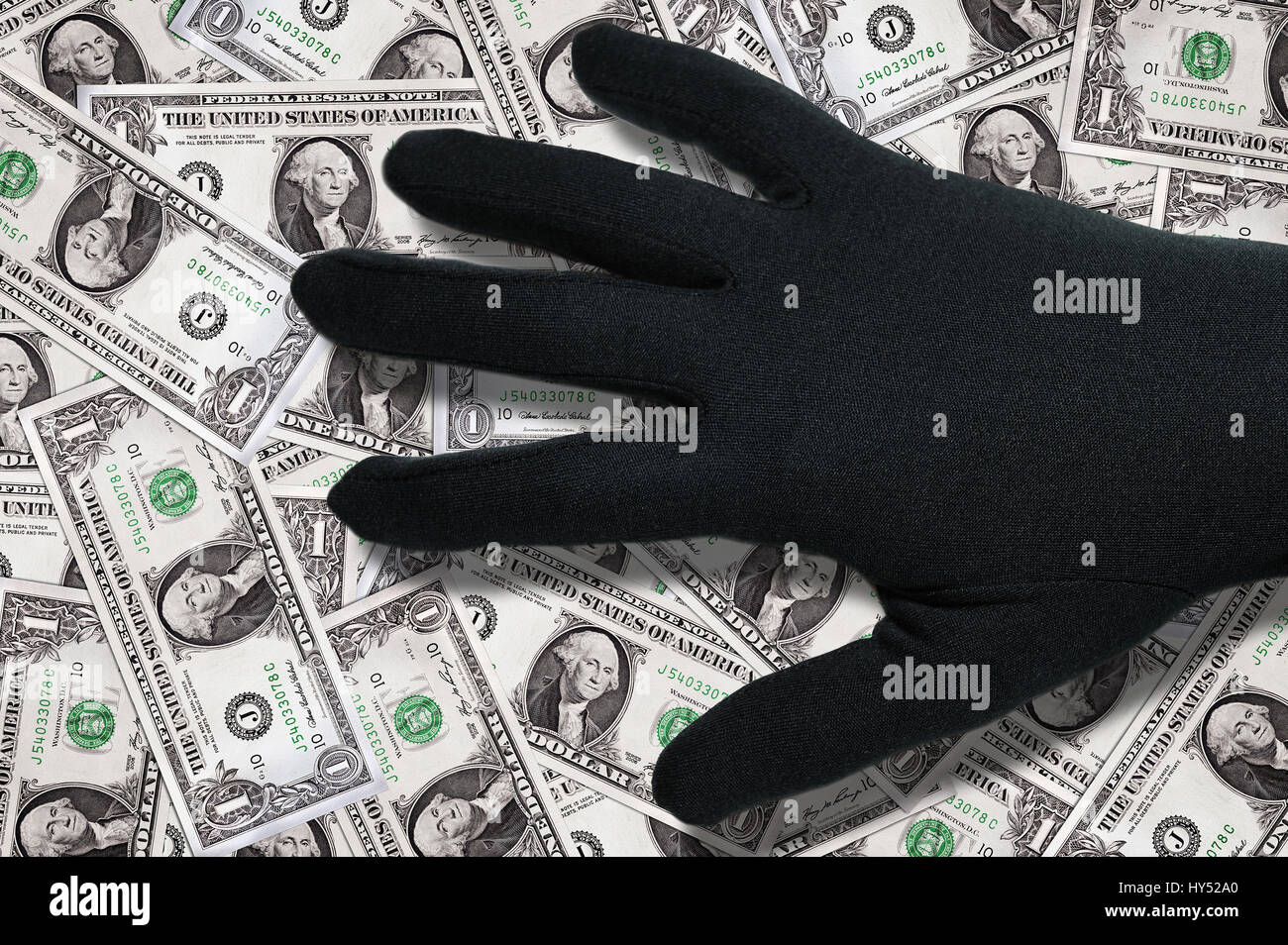 Black hand about dollar marks, Schwarze Hand ueber Dollarnoten Stock Photo