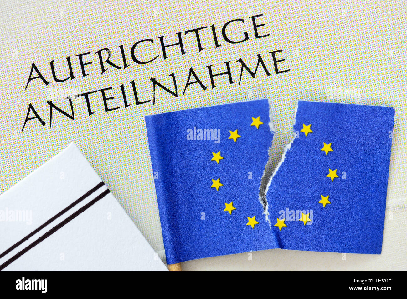Torn EU flag and condolence card, decay of Europe, Zerrissene EU-Fahne und Beileidskarte, Zerfall von Europa Stock Photo