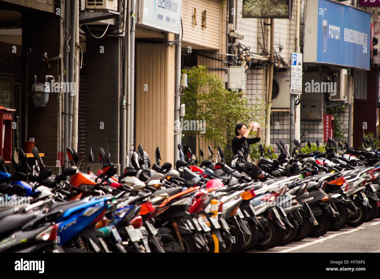 Motor cycles parked, Yangping S.Road, Zhongzheng, Taipei, Taiwan Stock Photo