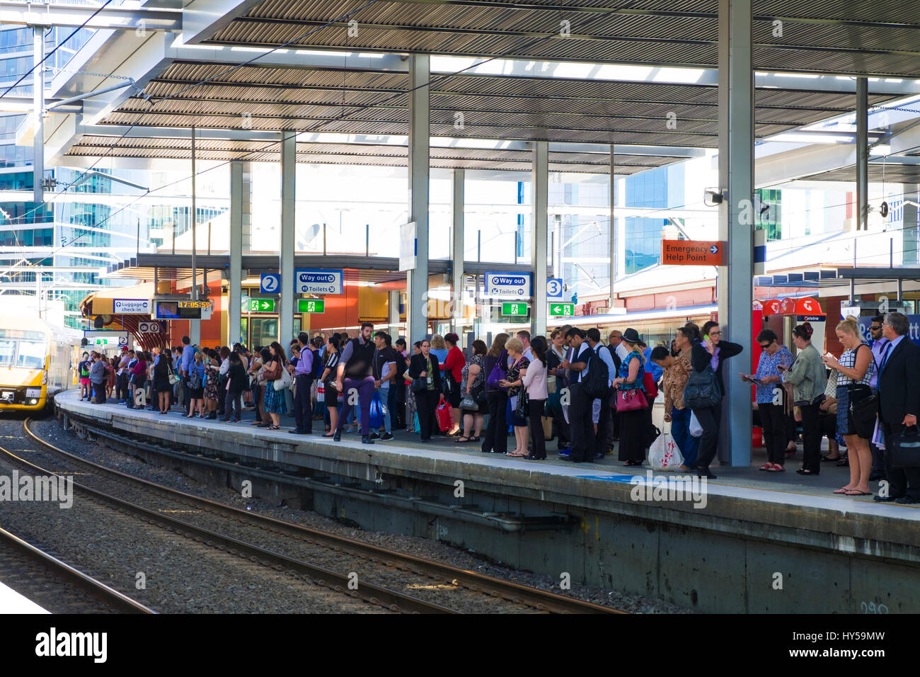 Rail commuters waiting: crowded platform at Parramatta Station, Sydney, Australia. Peak hour crowds. Going home from work.Commuting. Many commuters Stock Photo