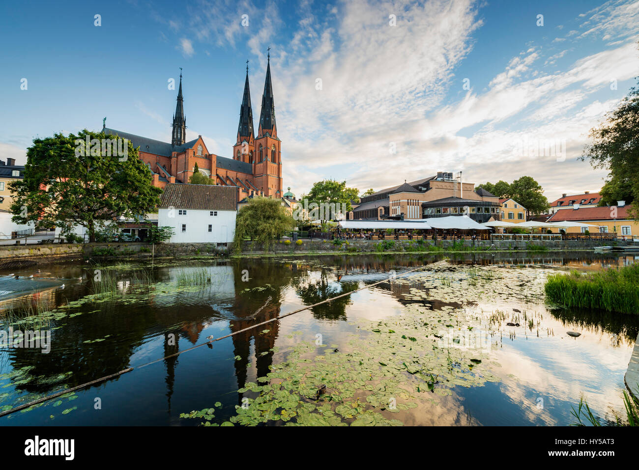 Sweden, Uppland, Uppsala, Uppsala Cathedral by pond Stock Photo