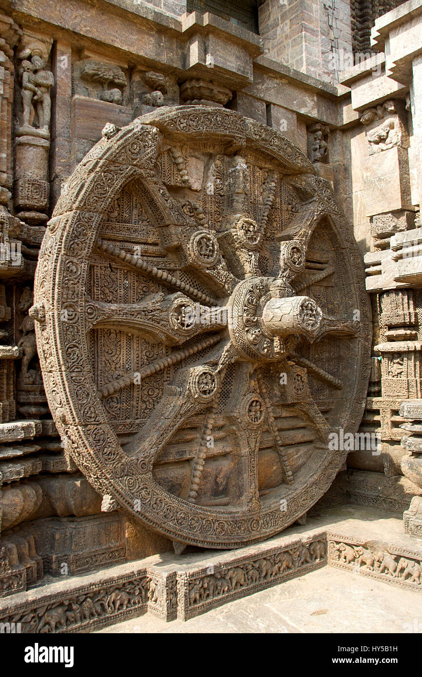 Detail of intricately carved stone wheel of chariot at Sun Temple in Konark, Orissa, India, Asia Stock Photo