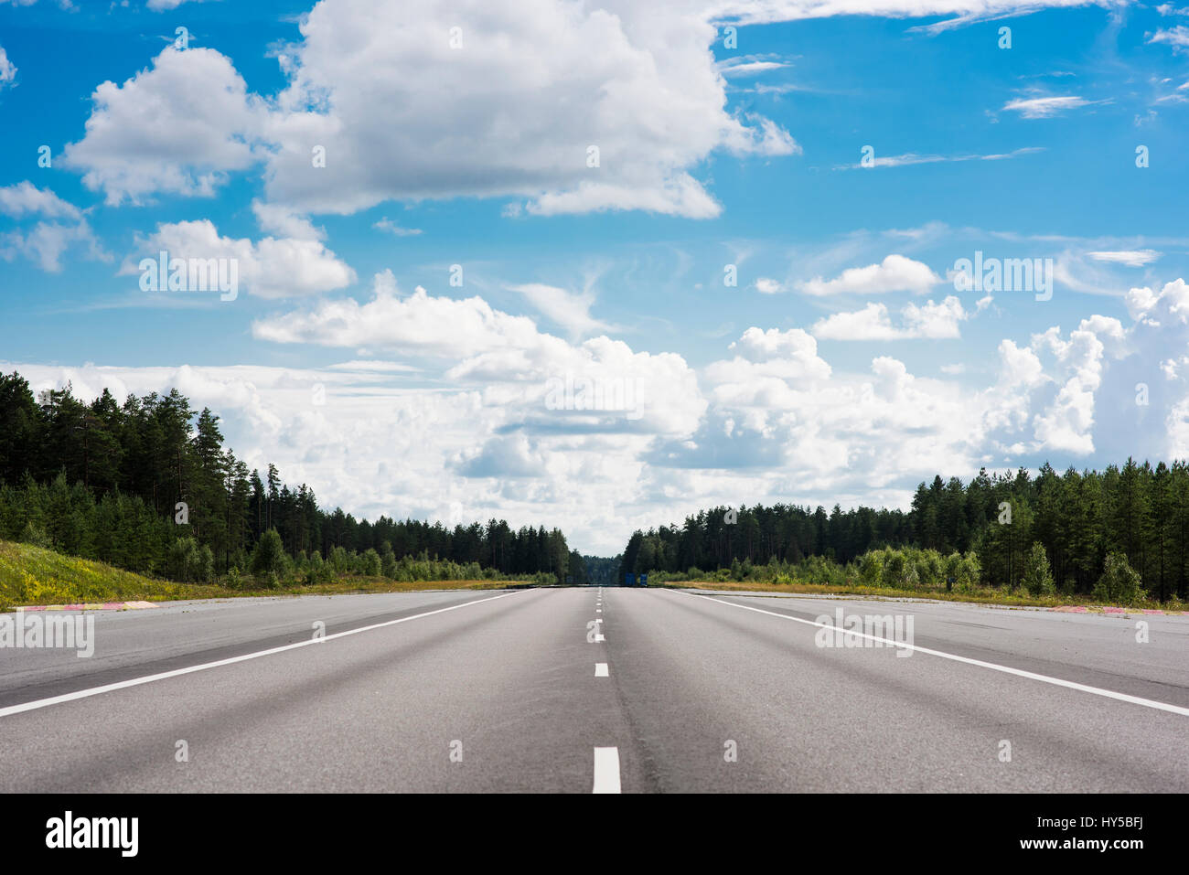 Finland, Varsinais-Suomi, Lieto, Blue sky over road Stock Photo