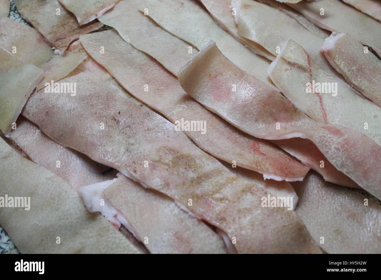 fresh pink pork skin with blood use in many industry begin from cook , technology and fashion Stock Photo